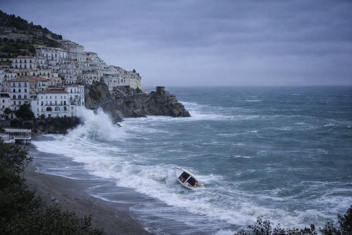 Powerful Mistral winds hitting the Amalfi Coast with dramatic waves during Italy Amalfi Coast Tours