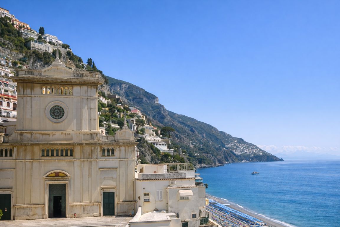 Santa Maria Assunta church overlooking Positano coastline during guided experience with Italy Amalfi Coast Tours